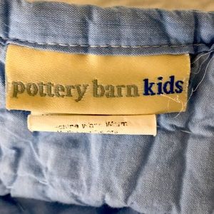 Pottery barn quilt with various trucks.